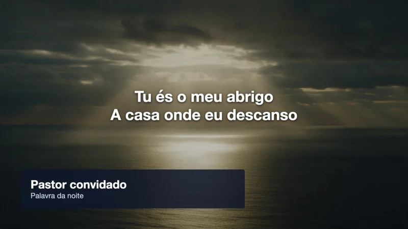 O telão com a legenda Pastor convidado, Palavra da noite, por cima da letra.
