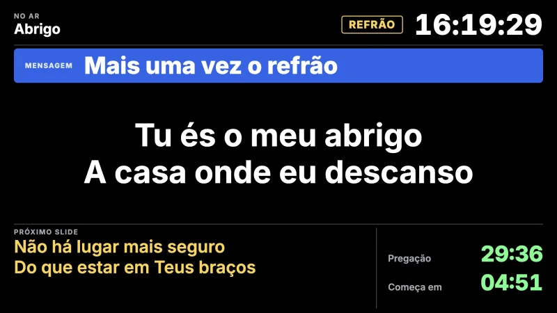 Retorno de palco no modelo Louvor: letra grande, a próxima linha em amarelo, o relógio e o recado da técnica.